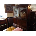 A Mahogany bookcase on cupboard base