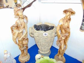 An Oriental vase and two sage figures