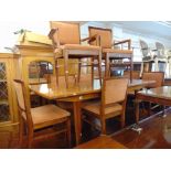 A Mid-century Scandinavian Teak extending dining table and eight chairs ( six chairs and two
