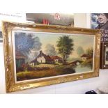 A gilt framed landscape oil signed