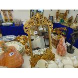 An ornate gilt art nouveau free standing mirror