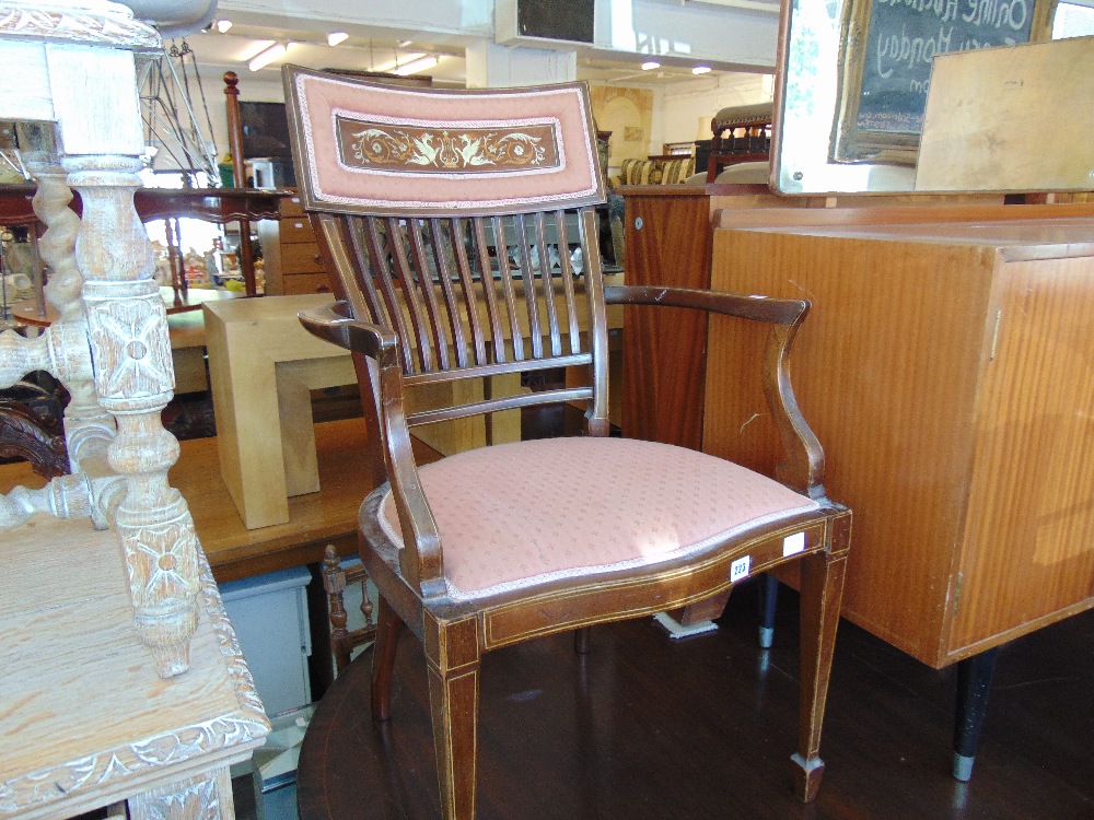 An inlaid upholstered Edwardian elbow chair