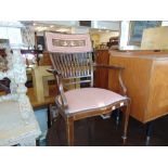 An inlaid upholstered Edwardian elbow chair