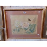 A framed oriental silk panel