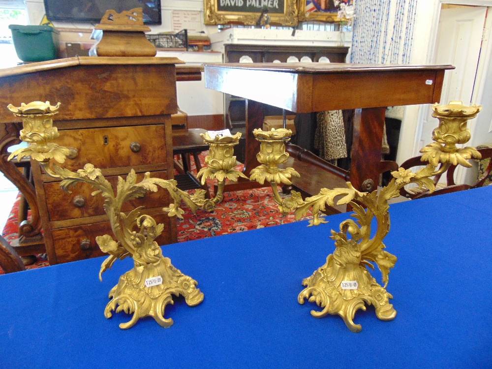 A pair of ornate gilt candlearbras