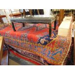 A large red ground eastern rug, 235 x 290 cm,