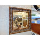 A gilt decorative mirror