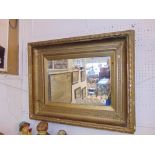 An antique gilt framed mirror