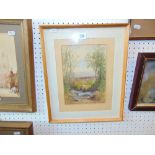 A framed watercolour woodland scene