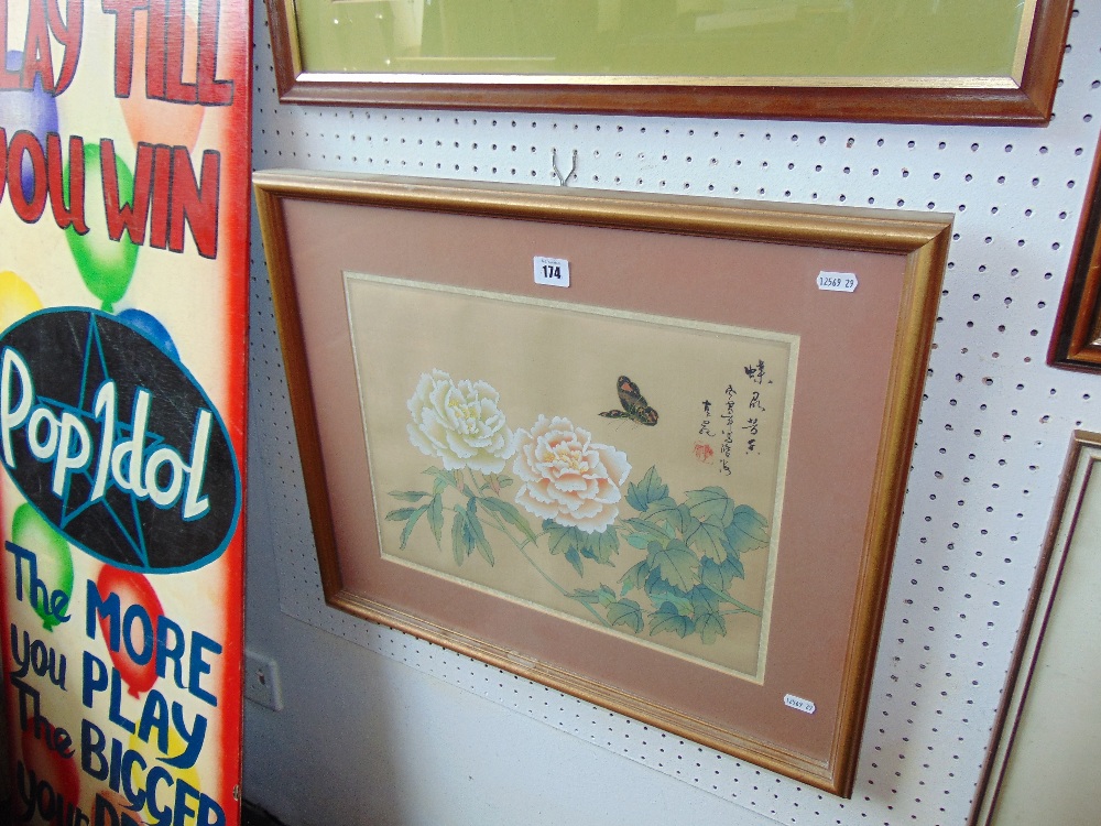 A framed oriental silk panel