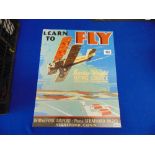 A 'Learn to fly' poster, 40.