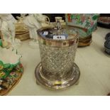 A cut glass silver plated biscuit barrel on stand