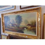 A gilt framed landscape oil signed