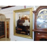 A silver gilt framed mirror