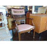 An inlaid upholstered Edwardian elbow chair