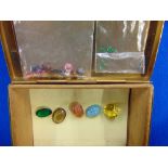 An assortment of assorted gemstones in box