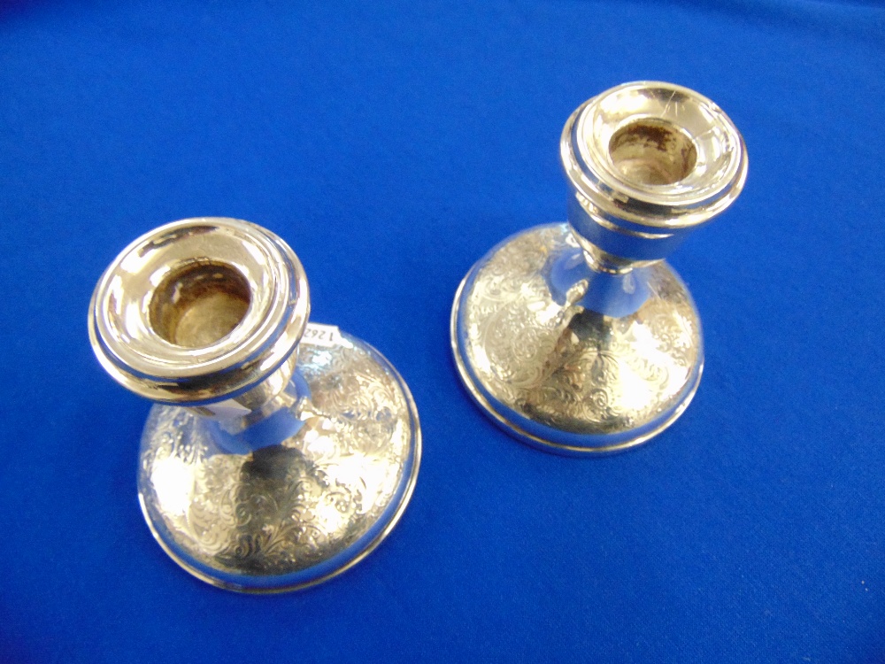 A pair of hallmarked Silver candlesticks