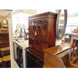 A Mahogany bookcase on cupboard base