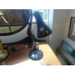 A black angle poise lamp