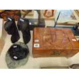 A carved box and a pair of ethnic bookends