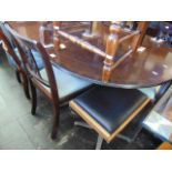 A Regency style Mahogany table and chairs