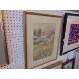 A framed watercolour cottage scene