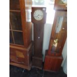 An Artdeco Oak Granddaughter clock a.