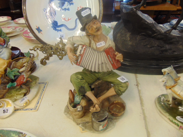 Two Capodimonte figures 'The Accordionist' and 'The Hunter' limited edition,