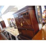 A Mahogany bookcase on cupboard base