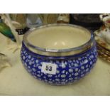 A continental blue and white pattern bowl with silvered rim