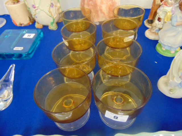 Eight Amber glass champagne coupes