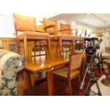 A Mid-century Scandinavian Teak extending dining table and eight chairs ( six chairs and two