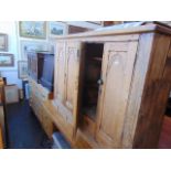 A Pine Gothic style cabinet with one interior drawer, a.