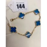 An 18ct Gold bracelet, wit blue stained Agate- Al hambra design by Van Cleef Arpels,