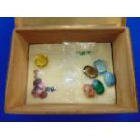 An assortment of assorted gemstones in box