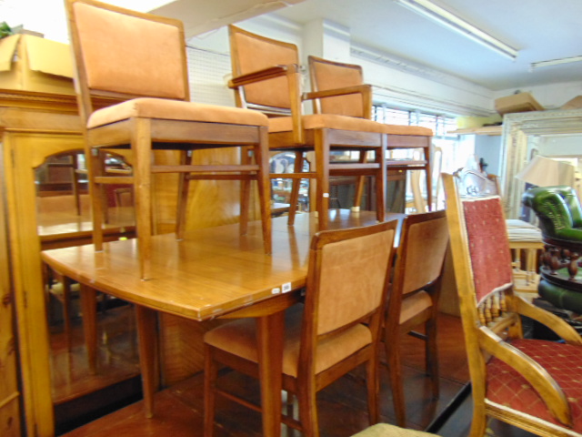 A Mid-century Scandinavian Teak extending dining table and eight chairs ( six chairs and two