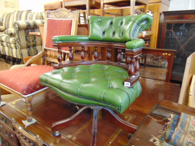 A leather swivel Captain's chair