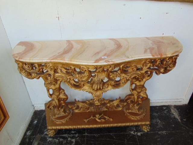 A Barocco style table with marble top