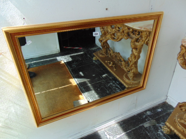 A gilt wall mirror