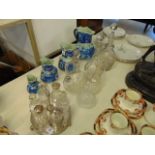 Five decanters and a cruet set