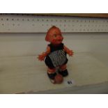 A vintage toy doll with ball