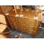 An Oriental style Walnut three drawer chest