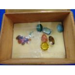 An assortment of assorted gemstones in box