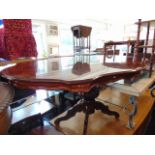An Italian style mahogany table