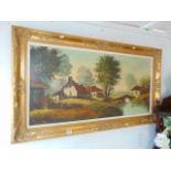 A gilt framed landscape oil signed