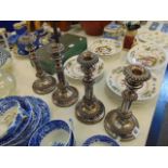 Four plated adjustable candlesticks