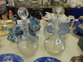 A pair of decorative bobble design decanters wit deer engraved