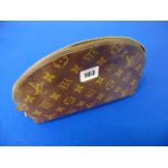A Louis Vuitton monogram pouch, needs a little attention inside,