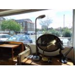 A stainless steel daylight floor lamp and two table lamps