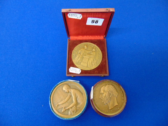 Three assorted bronze medals; Artdeco Nude lady making tapestry by P. - Image 2 of 2